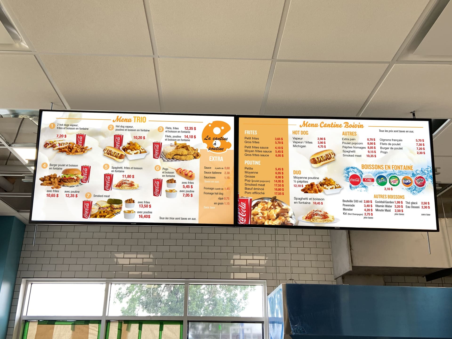 Le menu de la Cantine Boivin est affiché sur un téléviseur ACL au-dessus du comptoir de service. - Panorama Média